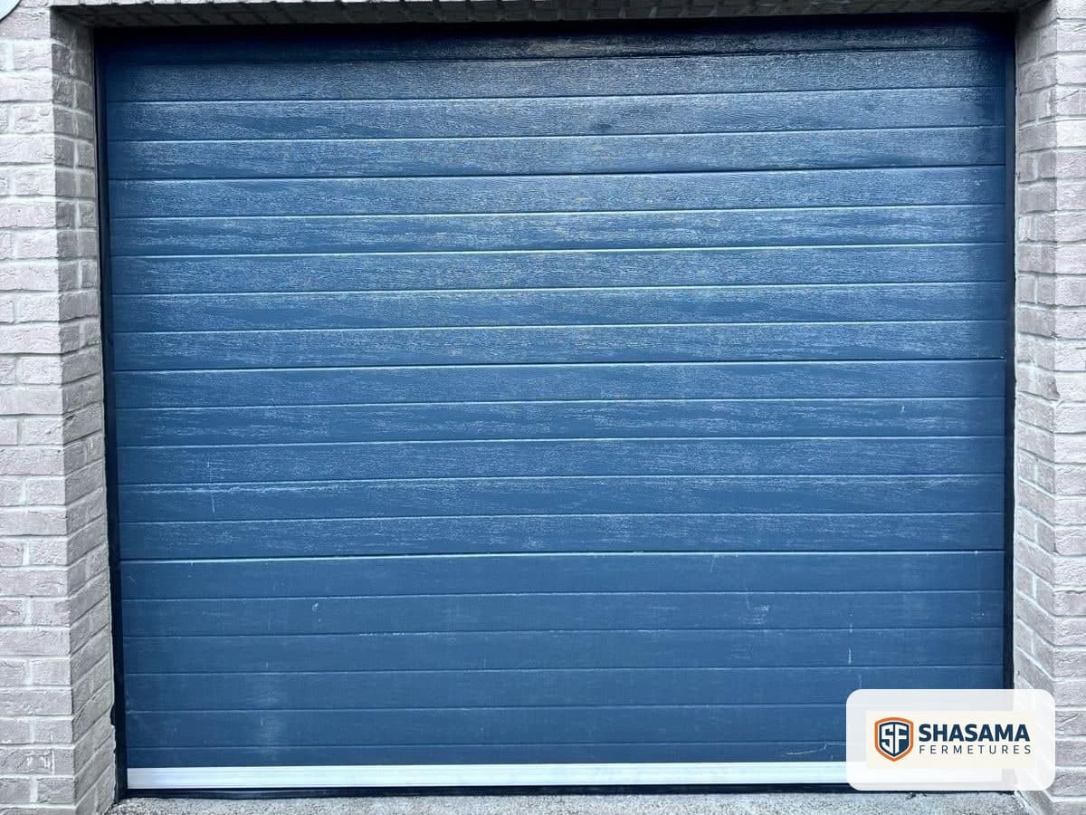 New sectional garage door closed, seen from outside the garage opening after fitting